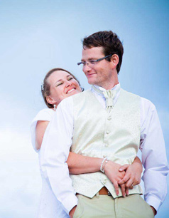 couple holding each other by the sea